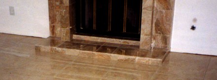 Custom tiled fireplace and floor